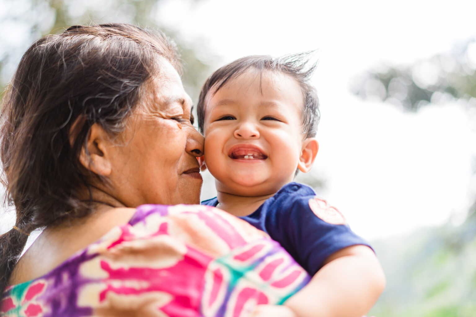 Indian grandmother holding her grandson