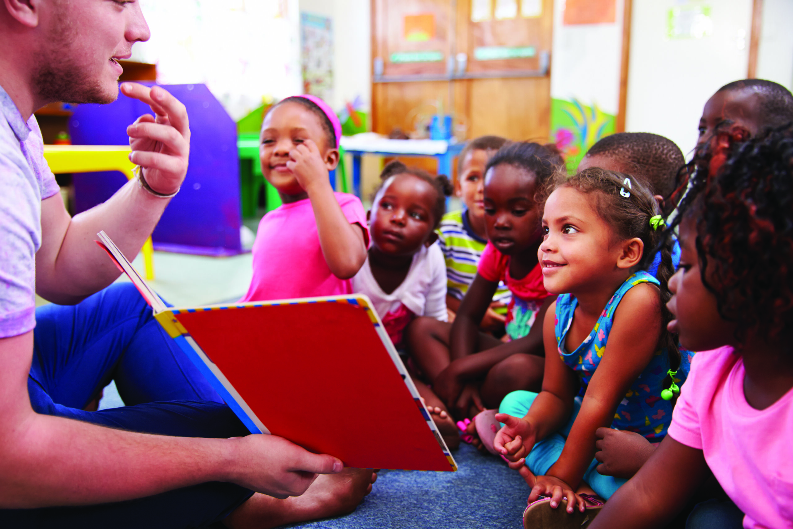 Volunteer reading to children