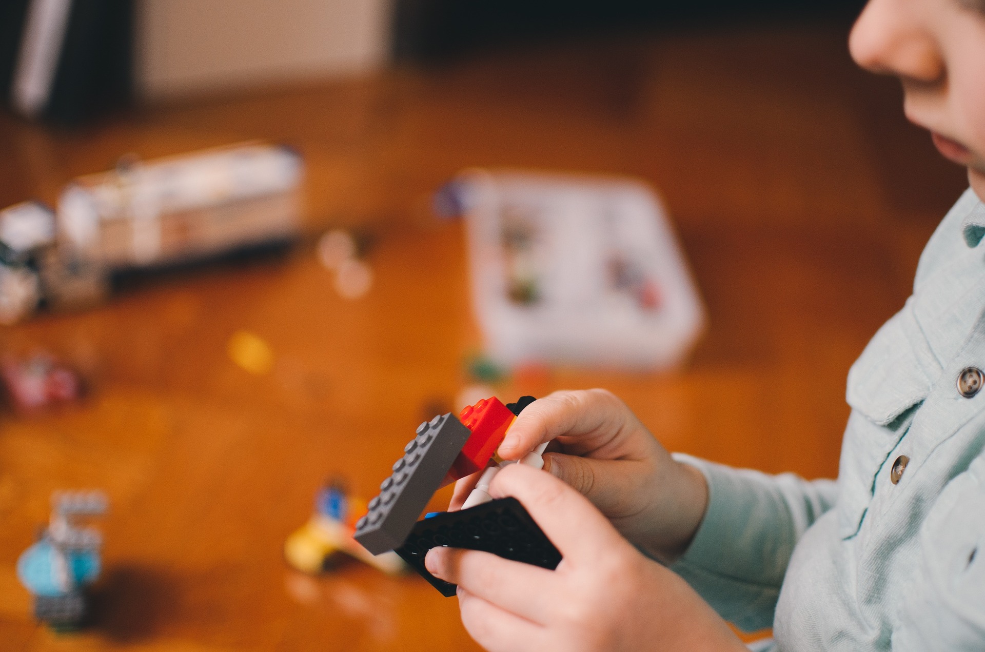 Child plays with lego