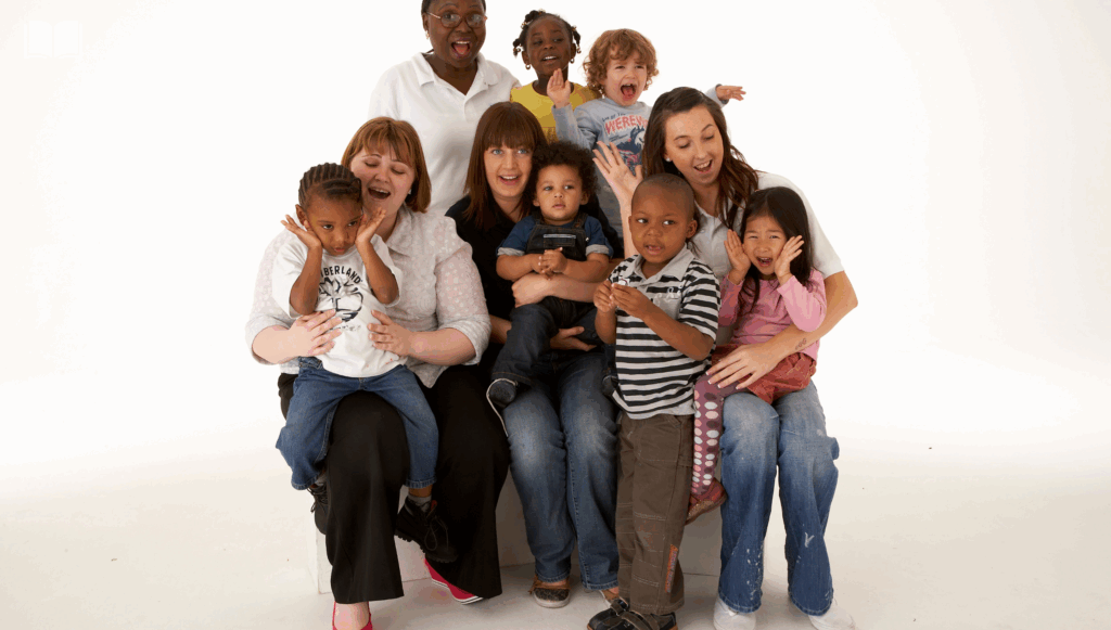 Group of adults and children smiling at the camera