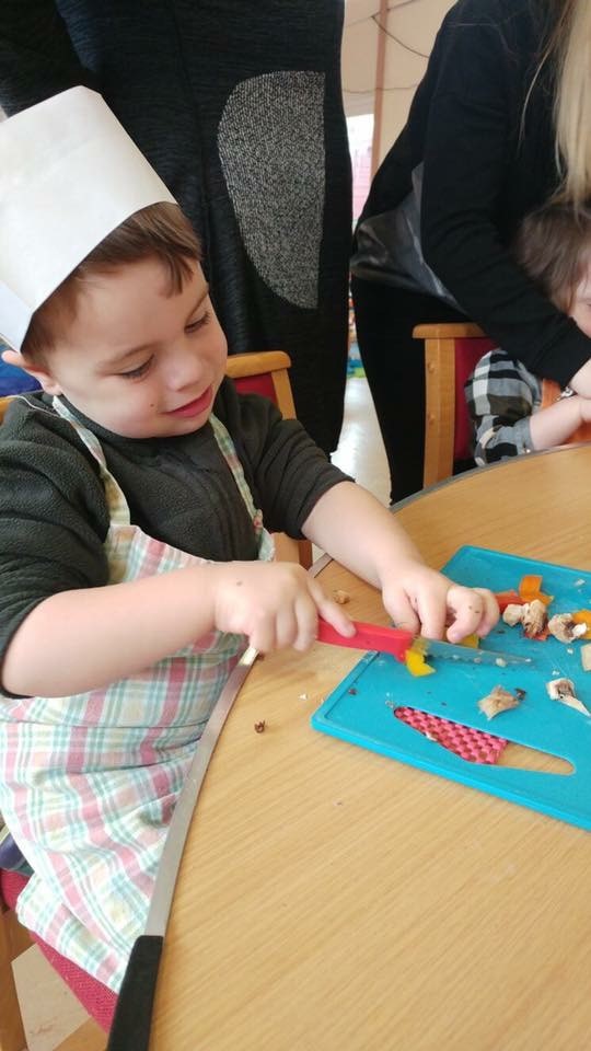 Chopping up fruit at the Hungry Caterpillars group