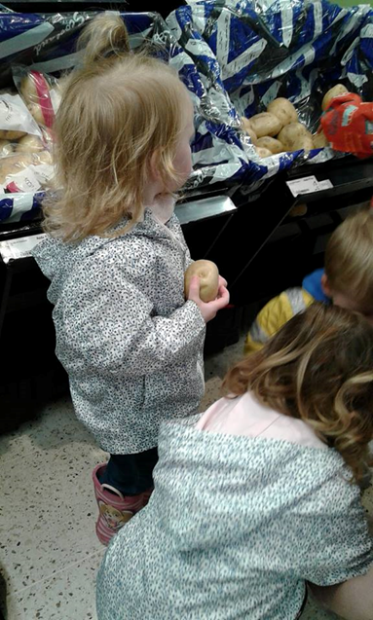 Children choosing vegetables for soup making