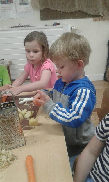 Children preparing vegetables for soup