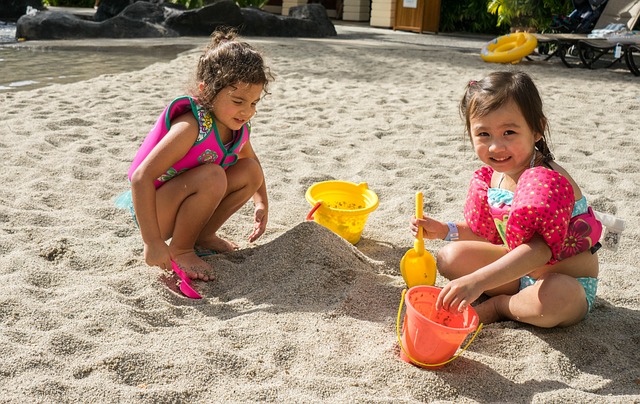 Little girls playing the sand