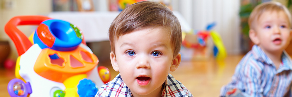 curious baby boy studying nursery room