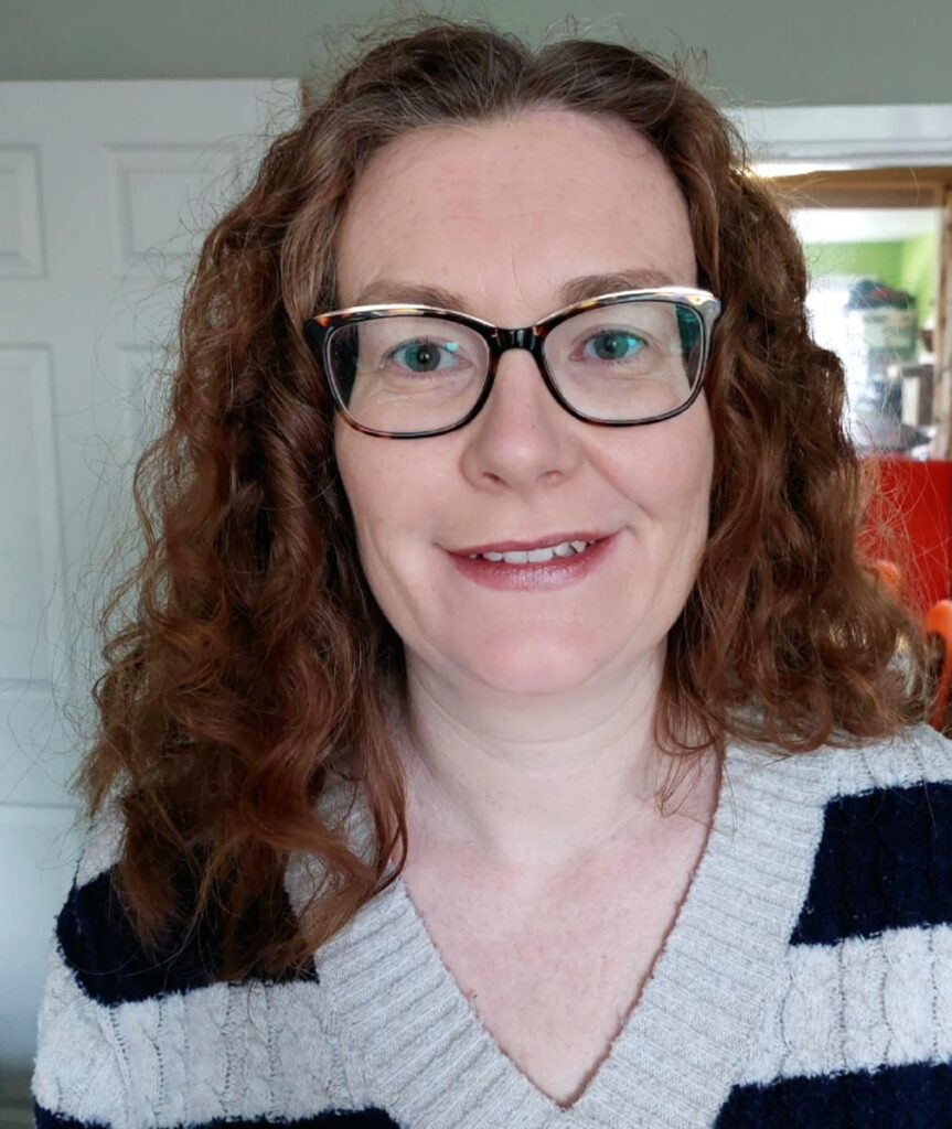 Headshot of Claire Reid, children's services director