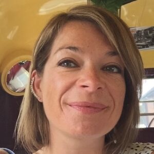 A close up photo of Louise, a member of staff at the Alliance. She is smiling slightly.