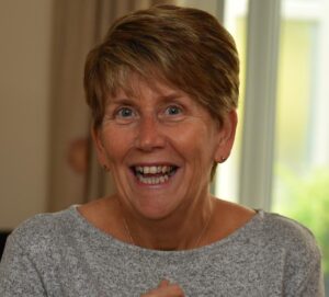 Image of Sharon Bond smiling wearing a grey top
